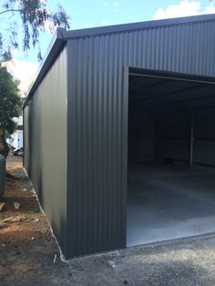 an open garage door on the side of a building