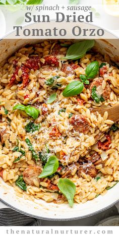 sun dried tomato orzo with spinach and sausage in a skillet