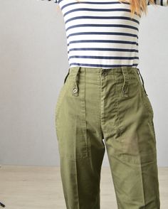 "Vintage Mens British Army Issue Work Trousers - Olive Green - Various Sizes - ADJUSTABLE Fantastic Grade A true vintage British military work pants in a mid-weight cotton blend. Tailored and flattering easy to wear design that makes them ideal for wearing day to day. We have these available in sizes 24\"-38\". Features - 1 buttoned back pocket - Wide belt loops - Zip and button fly - Waist adjusters at the side which tighten (so if unsure size up and bring in to fit) - Deep slashed side pockets Retro Cotton Cargo Pants With Pockets, Military Style Straight Leg Cotton Bottoms, Green Military Cotton Bottoms, Green Military Style Cotton Bottoms, Military Style Wide Leg Cotton Work Pants, Vintage Green Cargo Pants, Vintage Green Bottoms With Cargo Pockets, Vintage Green Cotton Work Pants, Military Style Straight Leg Cotton Work Pants