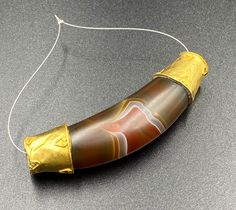 The Beautiful Crescent Moon Shape Amulet Banded Agate Bead Wrapped In Gold Probably From Ancient Historic Cultures Civilizations Of South East Asian Regions. Size Details Pictures Are Listed Above. Good Conditions As Shown In The Pictures. Quite Big Size Bead. We Provide Fast And Free Shipping Service World Wide To Our Customers .We Ship Mostly Via Fedex And DHL. If You Have Any Questions Please Feel Free To Send Us Message. Gold Agate Beads For Jewelry Making, Artisan Gold Gemstone Beads And Cabochons, Beaded Brass Amulet Jewelry, Brown Oval Beads Amulet Jewelry, Hand-strung Oval Beads Amulet Necklace, Polished Amulet Beads, Artisan Gold Beads, Gems, And Cabochons, Hand-strung Agate Amulet Beads, Ll Bean Boot