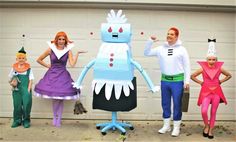 four people in costumes standing next to each other