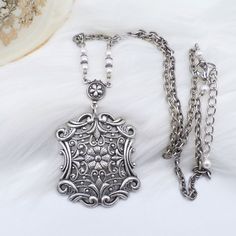 This NEW (made to look old) necklace was handmade by ME and is made to look like a Vintage treasures from the past.  The stunning focal pendant is a very intricate European style German made antique silver plated brass rectangular shaped piece that features very detailed floral and filigree scrollwork patterns on the front side.  It is so well done and filled with gorgeous details.  The back is HOLLOW and is shown n the listing pictures.  I have also added a floral silver plated connector and wh Scrollwork Pattern, Old Necklace, Ella Enchanted, Jewelry Victorian, Brass Texture, Art Nouveau Style, Fancy Jewelry, Silver Filigree, Silver Chain Necklace