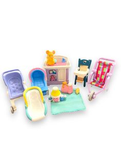 a doll house with furniture and accessories including a baby's high chair, sink, crib, potty seat, and bathtub