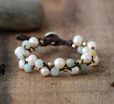 This splendid Boho Beaded Bracelet is carefully handmade with  Natural Fresh water  pearls . It features a Charming and Simple Design Giving you the  Charming Natural Inspired Beauty . This Bracelet is handmade with natural pearls, because of that the shape and color of the beads might be slightly different than on the picture ; this is what makes  this Bracelet unique, just like you!   Size:  Around 17-17.5cm Material:  Freshwater Pearls ,Genuine Leather Wrap Armband, Treasure Jewelry, Freshwater Pearl Bracelet, Bohemian Bracelets, Jasper Beads, Freshwater Cultured Pearls, Bijoux Diy, Braided Bracelets, Boho Bracelets