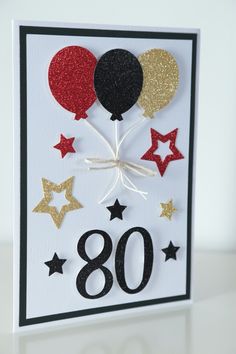 an 80th birthday card with balloons and stars