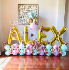 the letters alex are made out of balloons