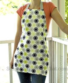 a woman wearing an apron standing on a porch