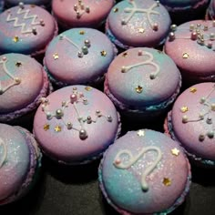 some pink and blue cupcakes with stars on them