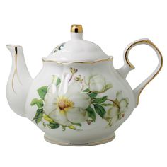 a white tea pot with flowers painted on the side and gold trimming around it