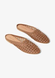 SHANTI - WHITE LEATHER MULES – salt + umber Leather Slip-ons With Woven Sole For Summer, Casual Slip-on Mules With Woven Sole, Leather Slip-ons With Woven Sole For Spring, Spring Brown Clogs With Textured Sole, Casual Woven Leather Flats With Round Toe, Brown Slip-on Mules With Textured Sole, Brown Textured Sole Slip-on Mules, Casual Leather Slippers With Woven Sole, Casual Almond Toe Mules With Leather Footbed