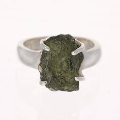 SpecificationsItem Code: SR995Size US: 7Weight: 35 Carats (7 grams) Unique Qualities Expertly made with authentic Czech moldavite, this exquisite ring is crafted from premium sterling silver. Featuring a one-of-a-kind size 7 design, this ring is a must-have addition to any jewelry collection. Elevate your style with a touch of refinement and grace with this remarkable moldavite ring. Moldavite Ring, Moldavite Jewelry, Moldavite Stone, Gemstone Properties, Rare Stone, Authentic Design, Elegant Ring, Size 10 Rings, Multi Stone Ring