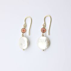 These 14 karat solid yellow gold earrings are pretty. They include coin pearl and Round Garnet Gemstones. These beautiful dangle earrings will make an excellent gift for yourself or a loved one on any occasion. Coin Pearl Size: 13 mm Garnet Size: 5 mm Gold Dangle Jewelry With High Luster, Gold High-luster Dangle Jewelry, 14k Yellow Gold Filled Round Pearl Earrings, Fine Jewelry 14k Gold Pearl Drop, 14k Gold Pearl Drop Fine Jewelry, White 14k Gold Filled Jewelry For Anniversary, Sterling Silver Yellow Gold Jewelry With Pearl Drop, Nickel Free White Gold Plated Jewelry, Fine Jewelry Pearl Drop With Round Beads