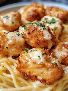 pasta with shrimp and parmesan cheese on it