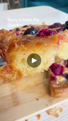 a piece of berry crinkle pie on a cutting board