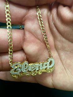 -Beautiful name necklace made in either 10k or 14k real solid gold, our double nameplates are personalized and made to order. Cuban link chain is 100% authentic 10k or 14k solid gold HEAVYWEIGHT (not hollow or semi hollow). *Cuban link chain weight approximately: 6-10 grams *Name charm dimensions approximately: 1.5"X1/5"INCHES (7 letters max) -how to order: *Select: name charm only or with 3mm necklace size -personalization: write the name you would like on your name charm follow by any request Customizable Gold Double Heart Name Necklace, Custom Name Yellow Gold 14k Name Necklace, Personalized Gold Cuban Link Name Necklace, Gold-plated Yellow Gold Name Necklace, Customized Yellow Gold-plated Name Necklace, Double Name, Cuban Link Chain, Necklace Size, Cuban Link