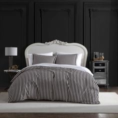 black and white striped bedding in a bedroom