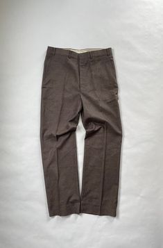 "Vintage New with Tags Sears Regular Fit Trousers Size: 36 x 31 Reg. Era: 1980's Material: 50% Polyester, 25% Rayon, 25% Acrylic Made in USA Details: New with Tags - Deadstock Sears Regular Fit Brown Trousers with Flap Pocket Back Pocket. All New, Perfect Condition. Flat Measurements - Waist - 17\" Inseam - 31\" Leg Opening - 9.5\"" Retro Fitted Winter Bottoms, Retro Fitted Bottoms For Winter, Vintage Tapered Leg Winter Pants, Vintage Relaxed Fit Pants For Winter, Vintage Fitted Bottoms For Winter, Fitted Vintage Bottoms For Winter, Vintage Fitted Bottoms With Welt Pockets, Retro Fitted Bottoms With Welt Pockets, Fitted Vintage Bottoms With Welt Pockets