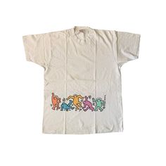 "Vintage 90s Keith Haring T-shirt Used condition. Has yellow stains. See pics! 100% cotton Single stitch THIS IS USED ITEM ! PLEASE DONT EXPECTED IT TO BE LIKE NEW OR IN PRISTINE CONDITION ! Size on tag: XL. Please check the measurements ! Measurements: Shoulders: 50 cm. (19.6\") Pit to Pit: 58 cm. (22.8\") Length: 82 cm. (32.2\") Worldwide Shipping: Approximate delivery time 14-30 days. Please be careful and ask any specific questions about item before purchasing. I can send you additional deta Cheap Throwback T-shirt With Direct To Garment Printing, Cheap 90s Inspired Cotton T-shirt, 90s Style Relaxed Fit Graffiti T-shirt, 90s Style Cotton T-shirt With Graffiti Print, Aaron Core, 90s Shirts Graphic Tees, Keith Haring T Shirt, Fashion 2000, Cute Clothing Stores