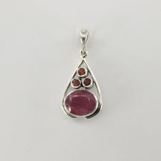 This is a beautiful red Ruby Pendant in 925 Sterling Silver. The metal is solid silver without any nickel or other substances causing most allergies making the jewelry hypo allergenic. Size of the Pendant (in total incl. Bail)   3.3 x 1.5 cm or 1.30 x 0.59 inch Please note: Our jewelry is photographed close up to show detail and may appear larger than they are. We are happy to help with any questions. You will receive the item in a gift box - perfect to surprise someone or yourself. Usually we s Oval Sterling Silver Birthstone Gemstones, Classic Red Teardrop Pendant Jewelry, Red Drop Gemstone Jewelry, Red Gemstone Drop Jewelry, Oval Sterling Silver Gemstones With Polished Finish, Oval Ruby Jewelry With Natural Stones, Red Teardrop Fine Jewelry, Red Gemstone Oval Pendant Jewelry, Red Teardrop Gemstone Jewelry