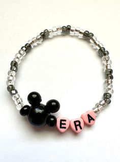 Currently living in my Mouse Ears Era. Glass seed beads are strung with pink heart shaped letter beads and finished off with a black mouse ear head bead. Perfect for a day in the parks!  Bracelets are available in a variety of lengths.  Pick your custom length from the drop down menu below.  Please be aware that beading may slightly differ from what is pictured as to accommodate selected sizing.  All our bracelets are made with quality in mind.  With that being said, all bracelets should be trea Cute Black Beaded Bracelets For Birthday, Cute Black Bracelets With Letter Beads, Cute Customizable Black Jewelry, Heart Shaped Letter, Black Mouse, Letter Beads, Thank You Stickers, Inspired Jewelry, Mouse Ears