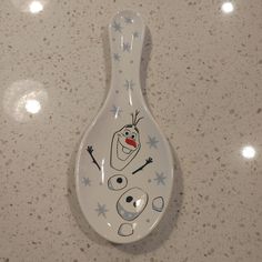 a spoon with a cartoon character painted on it