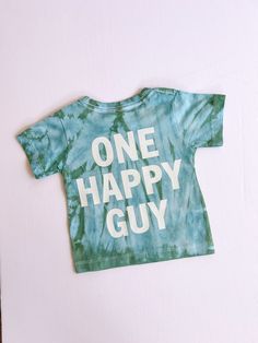 "Celebrate your little one's big milestone with a touch of retro charm with our \"One Happy Guy\" first birthday shirt for baby boys. This tie-dye shirt is the perfect blend of fun and style for your little man's special day. Featuring a vibrant color palette and a playful retro theme, this 1st birthday boy shirt is sure to stand out in all the birthday photos and create lasting memories. Made for comfort and cuteness, this one-year-old boy shirt is a must-have birthday outfit for your little gu Zayn Birthday, 1st Birthday Boy Shirt, Summer Birthday Cake, Guy Birthday, 1st Birthday Boy, Birthday Boy Shirt, First Birthday Shirt, Happy Guy, First Birthday Shirts