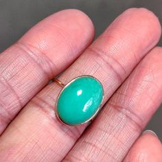 You can choose your own gem in my store. Let me know if you would like to see options Details of the ring Gem: Chrysoprase Gem shape & size: oval & 16×12mm Gold purity: 14K (58.33% approx.) Gold weight: 1.01 grams total weight of ring: 2.73 grams Fine cabochon Chrysoprase oval shape gemstone ring set in solid 14K yellow gold. The Gold purity is guaranteed and it comes with authentic 14 kt gold hallmark. Since these Rings are handmade, Same matching oval shape design earrings & pendan Yellow Gold Emerald Chrysoprase Cabochon Ring, Green Oval Opal Ring With Bezel Setting, Polished Chrysoprase Ring Suitable For Gift, Chrysoprase Emerald Ring In Fine Jewelry Style, Yellow Gold Chrysoprase Cabochon Ring, Chrysoprase Emerald Ring With Oval Cabochon For Gift, Green Chrysoprase Cabochon Rings, Chrysoprase Jewelry, Chrysoprase Ring