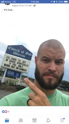 a man with a beard pointing to the camera