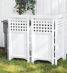 a white fence with flowers growing on it