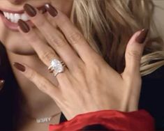 a close up of a person wearing a ring