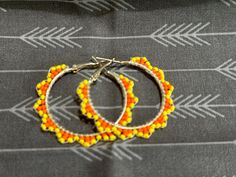 Small hand beaded hoops. With yellow and orange seed beads. Indigenous made Beaded Hoop Earrings, Beaded Hoops, Small Hands, Jewelry Earrings Hoops, Hand Beading, Bend, Seed Beads, Etsy Earrings, Hoop Earrings