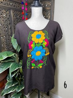 "A very nice and beautiful Sunflower Blouse w/Gorgeous Embroidery. The design work is simply gorgeous. Perfect for your ultimate weekend look, beach, casual look or just to impress your friends with this gorgeous piece. You will Love it! Blouse STYLE DETAILS Overview * Round neck * Handmade work * 3/4 Long sleeves * 22\" UNDERARM TO UNDERARM, 30.5\" SHOULDER TO HEM fabric & care * hand wash * delicate care * hang dry Please email me your questions before buying email me TODAY All of my items Summer Embroidered Tunic Blouse, Embroidered Tunic Blouse For Summer, Floral Embroidered Tunic Top For Vacation, Folk Style Tunic Tops For Beach, Summer Multicolor Embroidered Top With Embroidered Neckline, Summer Tunic Blouse With Multicolor Embroidery, Summer Multicolor Embroidery Tunic Blouse, Summer Embroidered Top With Floral Design For Vacation, Embroidered Tops For Beach In Summer