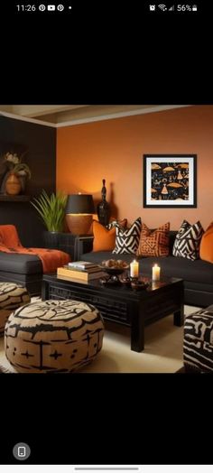 a living room filled with lots of furniture and decor on top of a wooden table