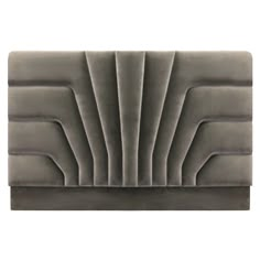 a gray velvet headboard with pleated edges