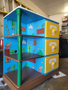 the shelves are made to look like mario's house with different levels and colors