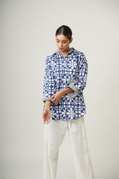 Introducing our Nightfall Blue Patchwork Block-Printed Organic Cotton Shirt, meticulously crafted from 100% organic cotton for unparalleled softness and sustainability. Handcrafted with precision, its intricate geometric pattern adds artisanal charm. With a versatile oversized fit and button detailing, it effortlessly transitions from office to casual wear. Stay cool and comfy in the summer months with this eco-friendly wardrobe essential. Specifications: Length: 31' inches, Customize it to your Oversized Indigo Cotton Tops, Relaxed Fit Cotton Shirt With Block Print, Cotton Shirt With Block Print And Relaxed Fit, Blue Block Print Relaxed Fit Top, Blue Relaxed Fit Top With Block Print, Long Sleeve Blouse With Block Print And Relaxed Fit, Cotton Block Print Relaxed Fit Top, Cotton Block Print Tops With Relaxed Fit, Cotton Block Print Long Sleeve Blouse