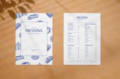 two menus sitting on top of a table next to each other with blue and white designs