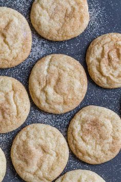 some cookies are sitting on a black plate