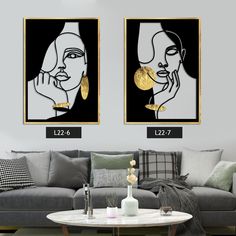 two paintings on the wall in a living room