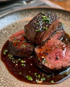 steak with sauce and garnish on a plate