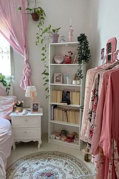 a room filled with lots of pink furniture and decor