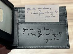 someone is holding their wallet with a note attached to the card holder that says, you're my home