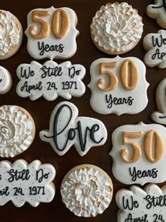 cookies decorated with 50th anniversary decorations on a table