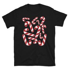 Cute Candy Cane Christmas T-shirt The perfect thing for anyone the loves Christmas and candy canes. Great for Christmas party shirt to wear to holiday parties or to school. * 100% ring-spun cotton * Sport Grey is 90% ring-spun cotton, 10% polyester * Dark Heather is 65% polyester, 35% cotton * 4.5 oz/yd² (153 g/m²) * Pre-shrunk * Shoulder-to-shoulder taping * Quarter-turned to avoid crease down the center * Blank product sourced from Bangladesh, Honduras, Haiti, Mexico, or Nicaragua New Year Red T-shirt With Graphic Print, Red Graphic Print T-shirt For New Year, Red Short Sleeve T-shirt For New Year, Holiday Gift Red T-shirt, Fun Red Top As A Gift, Fun Red T-shirt As Gift, Fun Red T-shirt, Candy Cane Shirt, Christmas Party Shirts