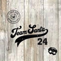 the team santa logo is shown on a wooden background with other items in black and white