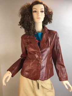 Vintage 70s Ox Blood Leather Blazer, says size 12 but fits much smaller than that. Excellent condition, one mark on lapel from pin or something but barely noticeable Shoulders 17.5 Chest 36 Inches Waist 33 Inches Nape to hem 22 Fitted Retro Vintage Brown Leather Jacket, Fitted Vintage Brown Retro Leather Jacket, Vintage Fall Business Blazer, Vintage Fall Blazer For Business, Vintage Brown Blazer For Office, Vintage Button-up Outerwear For Office, Vintage Brown Leather Jacket For Formal Occasions, Vintage Leather Jacket With Lapel Collar, Vintage Leather Jacket With Lapel Collar For Fall