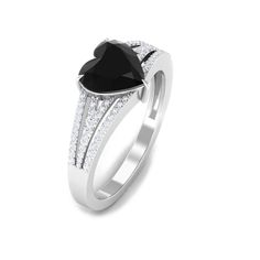 Product Details The stunning Heart Engagement Ring is embellished with a Heart Shaped Lab Created Black Diamond secured in Claw Setting while dainty Round Diamond studded on the split shank. Bend your knee and confess what lies in your heart for your special person with our Created Black Diamond Ring as she will always keep it close to her heart. Product Information SKU SHP-RINGS062310107 Width 8.5 mm Height 5 mm Weight 2.24 gm (Approximate) LAB CREATED BLACK DIAMOND INFORMATION No.of Stones 1 Pieces Total Weight 2.40 Carat (Approximate) Dimension(approx) Heart-8X8 mm-1 Pcs Color Black Cut Brilliant Shape Heart Setting Type Claw-Set Quality Grade AAAA DIAMOND INFORMATION No.of Stones 64 Pieces Total Weight 0.33 Carat (Approximate) Dimension(approx) Round-0.80X0.80 mm-2 PcsRound-0.90X0.90 m Heart Engagement Ring, Heart Engagement, Heart Engagement Rings, Claw Setting, Black Diamond Ring, Ring With Diamond, 18k Yellow Gold Ring, Signature Jewelry, Split Shank