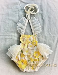 Cream Bubble Romper For Beach And Summer, Cream Bubble Romper For Beach In Summer, Cute Summer Bubble Romper For Garden Party, Spring White Bubble Romper For Beach, White Bubble Romper With Floral Print For Summer, White Spring Bubble Romper For Beach, Summer White Floral Bubble Romper, Summer White Floral Print Bubble Romper, Cute Cream Bubble Romper For Summer