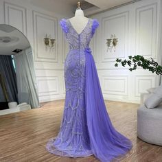 a dress is displayed on a mannequin in a room