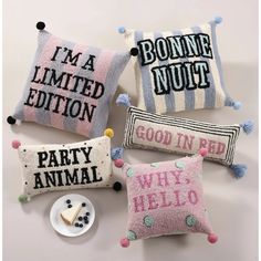 four pillows with different sayings on them